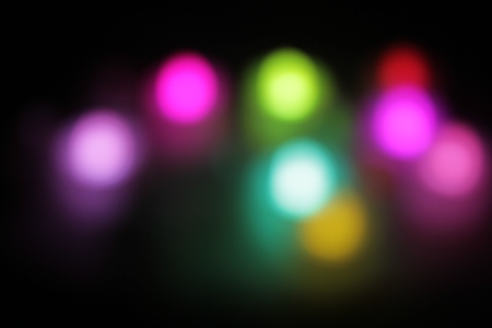Abstract circular bokeh background of candlelight and Christmaslight on dark nightの写真素材
