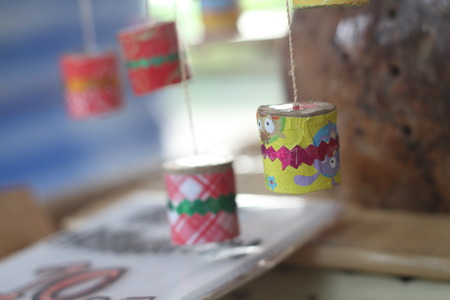 This thai retro toy calling \" Jak ka jan \" because when swing it. Sound like a cicada bug. It make from bamboo,clay, small rope and color paper.の写真素材