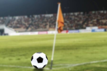 Soccer Ball On Green Field of football stadium for backgroundの写真素材