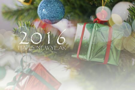 Happy new year and Christmas ornaments on the Christmas tree and Christmas background of de-focused lights on soft focus.の写真素材