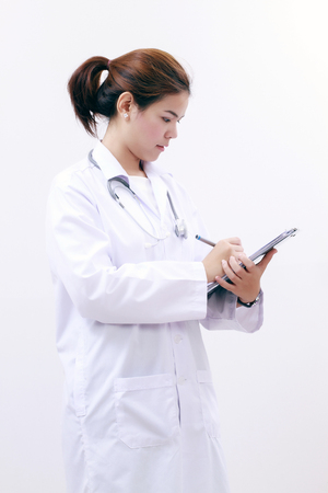 Smiling medical doctor woman asia with stethoscope and clipboard,on white backgroundの写真素材