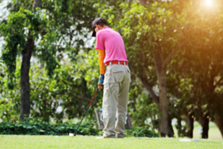 blurred golfers hit sweeping and keep golf course in the summer for relax timeの写真素材