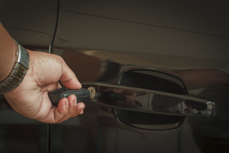 Hand hold key Opening car doorの写真素材