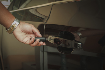 Hand hold key Opening car doorの写真素材