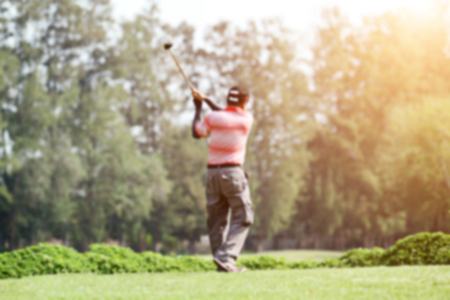 blurred golfers hit sweeping and keep golf course in the summer for relax timeの写真素材