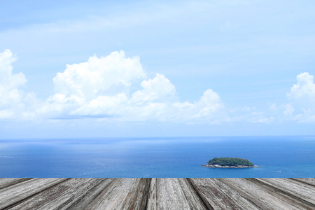 Wooden  floor and wood pier with blue sea and sky backgroundの写真素材