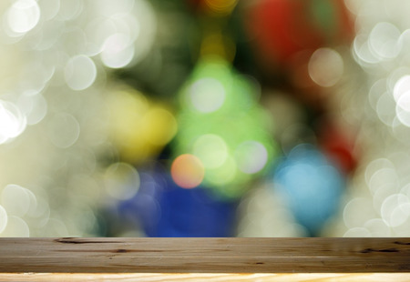 Wood table top on Abstract circular bokeh backgroundand Bokeh gold colour abstract background of...