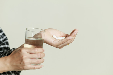 Asia women are taking medicines and vitamins for help Sick and healthyの写真素材
