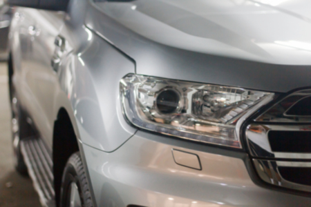 blurry and close up the headlights of carsの写真素材