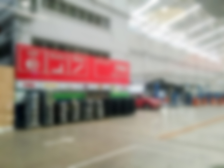 blurry cars on lifts in small service station for backgroundの写真素材