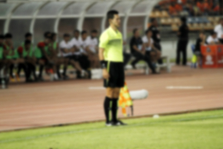 blurry Assistant football referee and Referee's flagの写真素材