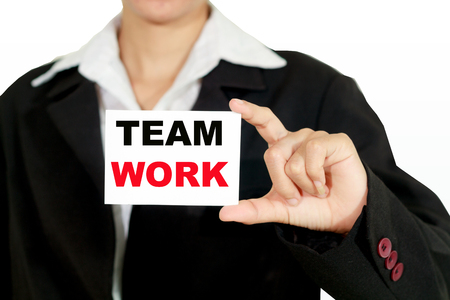 businesswoman asia holding and shown a TEAMWORK word on the business card on white backgroundの写真素材