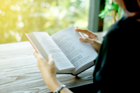 Blurry of Asian woman reading a book for relaxation .の写真素材