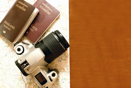Thailand passport and camera on the map for World travel and travel asia ,vintage toneの写真素材