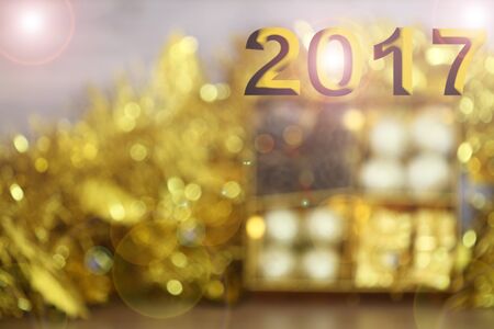 2017 Happy New Year background with gold bokeh backgroundの写真素材
