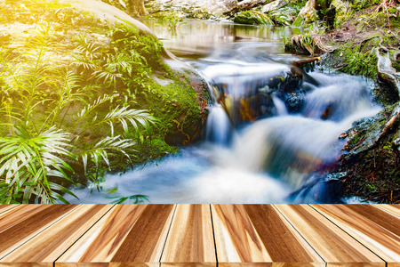 Perspective wood and Empty top wooden of waterfall in deep forest in thailandの写真素材