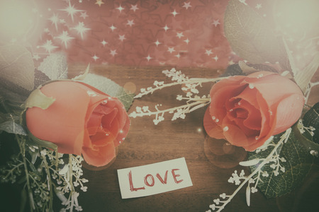 vintage of Valentines Day background with heart and roses on wood backgroundの写真素材