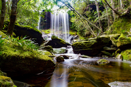 waterfall in deep forest in thailandの写真素材
