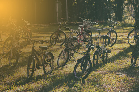 Vintage of  bikes parked on a hill at sunset.の写真素材