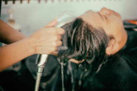 blurry of young man at the hairdresser salon hairstyle make modelの写真素材