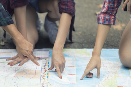 Asian Group of young people Hiking with friends backpacks walking together and looking map and...