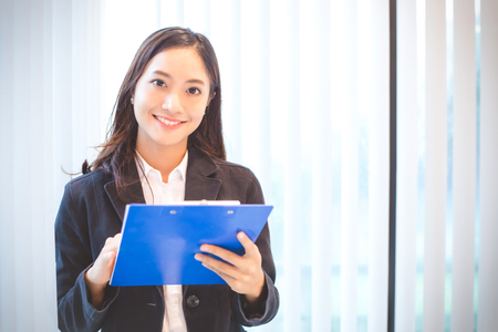 Asian business women smiling happy for workingの写真素材