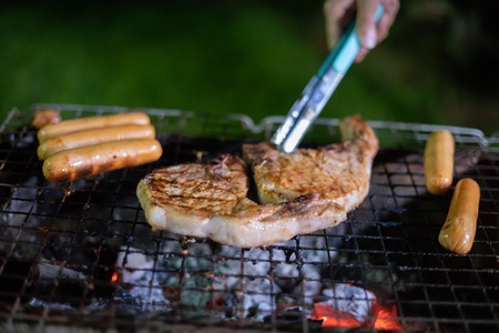 having outdoor garden barbecue at night