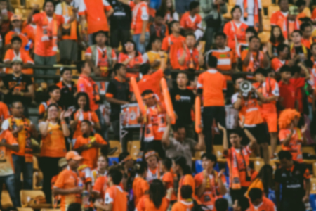 blurry of Soccer fans in a match and Spectators at football stadiumの写真素材
