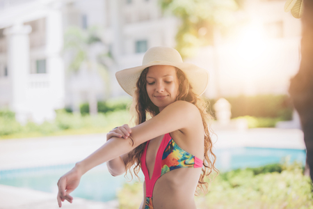 Women wear bikinis for swimming at the summer recreation poolの写真素材