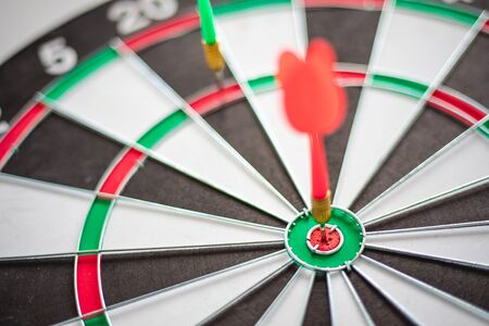 Dart hits Bullseye is a target and goal of business marketing as concept.