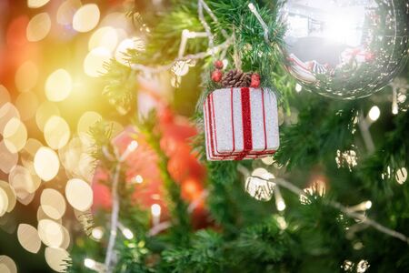 Happy new year and ornaments on the Christmas tree with gift box ,blurred and soft focusの写真素材