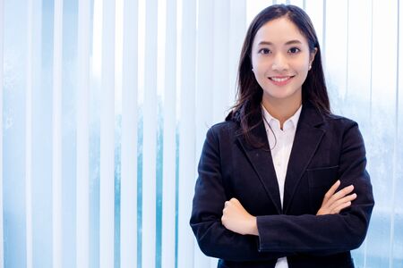 Asian business women and group using notebook for meeting and business women smiling happy for workingの写真素材