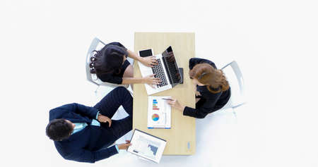 businessmen women  group using notebook for business partners discussing documents and ideas at meeting and business women smiling happy for workingの写真素材