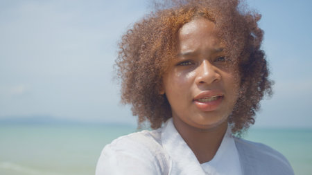 Young women play in the sea on their summer vacation and they smile and are happy on vacationの写真素材