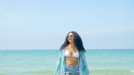 Young women play in the sea on their summer vacation and they smile and are happy on vacation