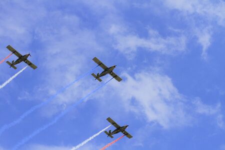 aircraft flying in the sky with smoke behind