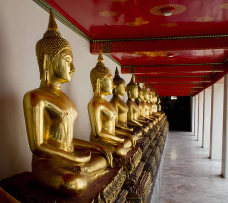row of buddhas statue in Thailand (shallow dept of field)