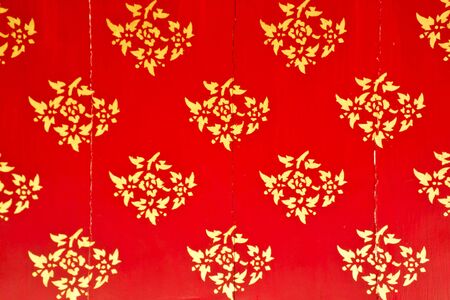 flower pattern in traditional Thai style art on wall of the temple