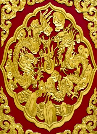gold dragon on red backgroundの写真素材