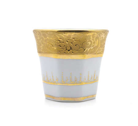 Gold paint white cup isolated on white background niceの写真素材