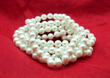 nice Pearl necklace on red backgroundの写真素材