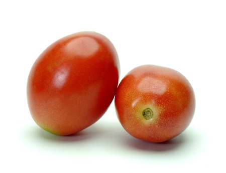 Two tomatoes on white background の写真素材