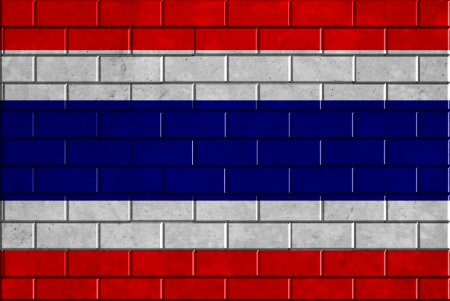Thailand flag painted on old brick wall texture backgroundの写真素材