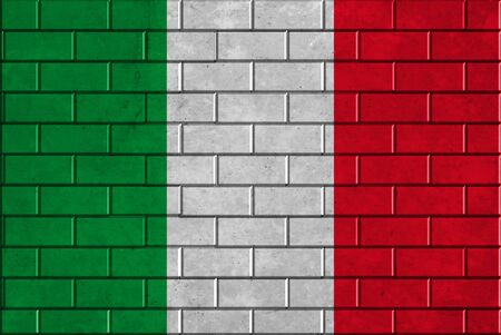 Italy flag on a brick wallの写真素材