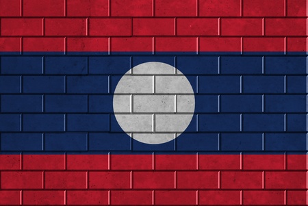 Laos flag painted on a brick wallの写真素材