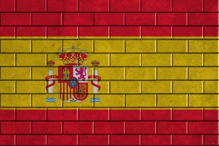 Spain flag painted on a brick wallの写真素材