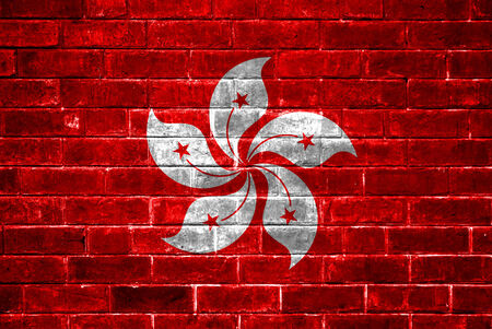 Hong Kong flag painted on a brick wallの写真素材