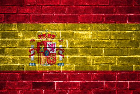 Spain flag painted on a brick wallの写真素材