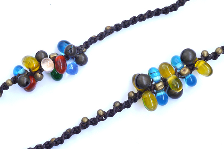 jewelry with colored beads isolated on whiteの写真素材