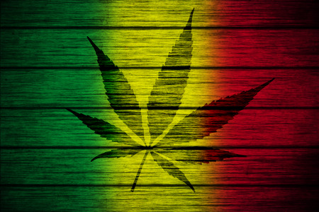 Background texture wood Rasta Flag with Marijuana Leaf silhouetteの写真素材